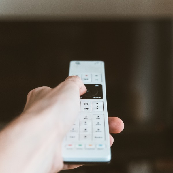 A person using a tv remote
