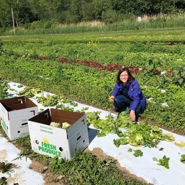Julie Raway picking greens in a large garden