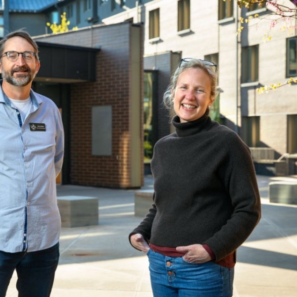 Steve Jackson and Lindsay Anderson standing outside of Keeton House