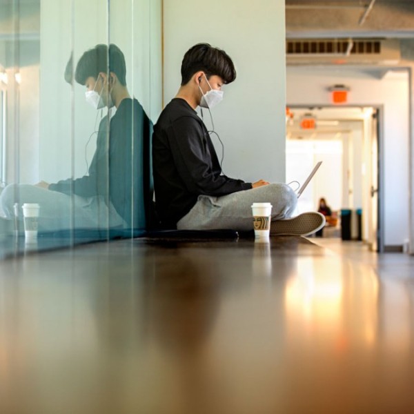 A student working in a hallway