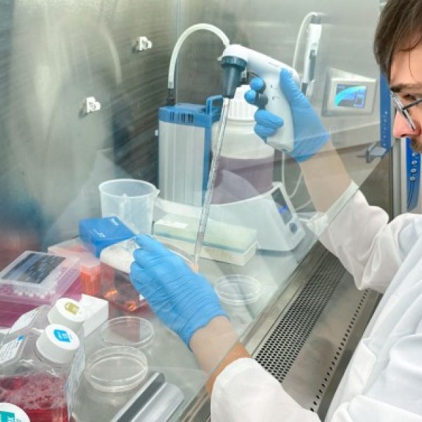 Julius Judd is shown growing human cells in a culture dish