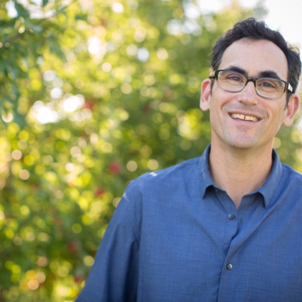 Greg Peck with apple tree in background