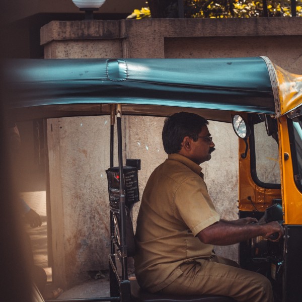 A man in India driving a car 