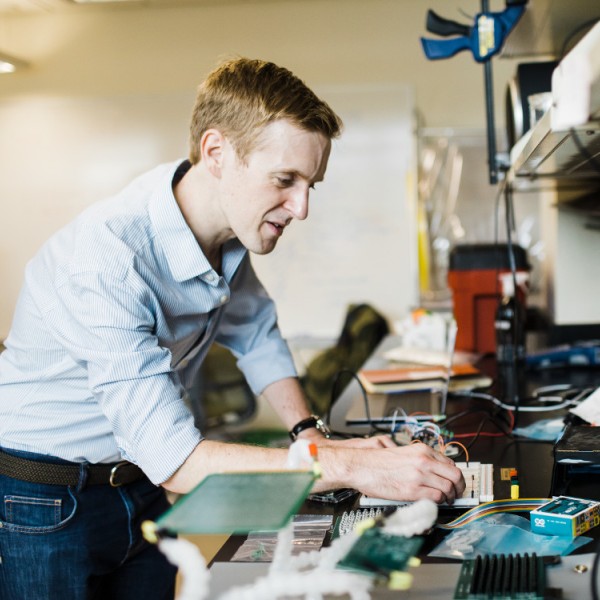 Buz Barstow working in his lab at a lab bench