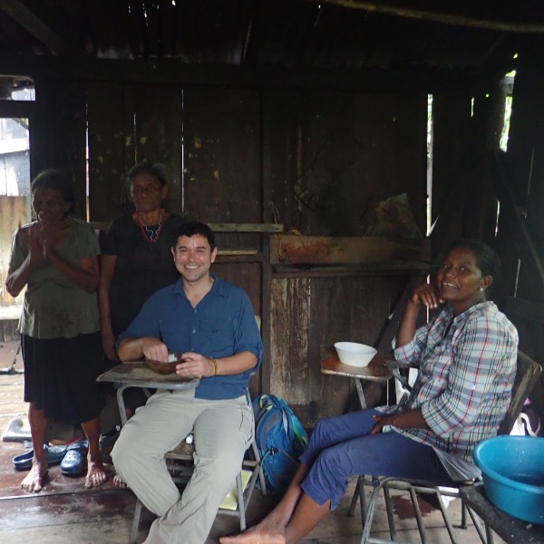 Individuals gather in home for an interview in Honduras