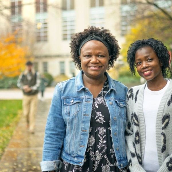 Two students stand in the Ag Quad.
