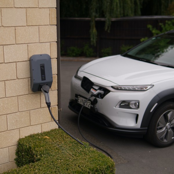 An electric car charging at home.