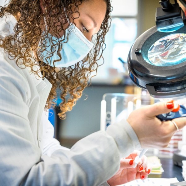 a vet student working in a lab