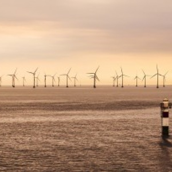Windmills over the ocean.