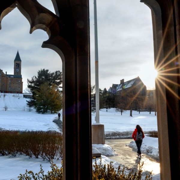 Students walk to class outside in the snow