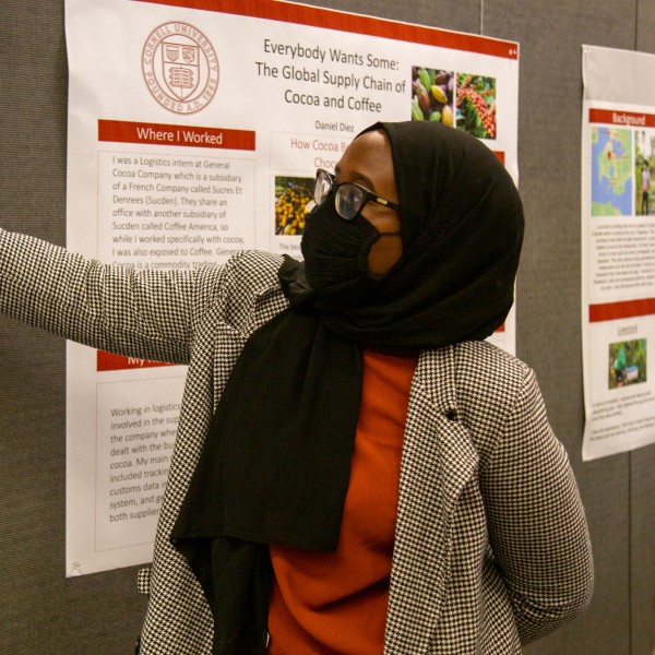 Woman presents at poster showcase