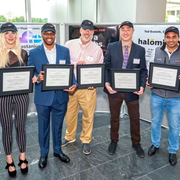 Lou Walcer (McGovern Center), left, Carrianne Fairbarne (Ava Labs), Hakim Weatherspoon (Exotanium), Ted Eveleth (Halomine), Stéphane Corgié (Zymtronix), John Pena (Sonder Research X) and Bob Scharf (Praxis Center) at the June 7 graduation event at Weill Hall. 