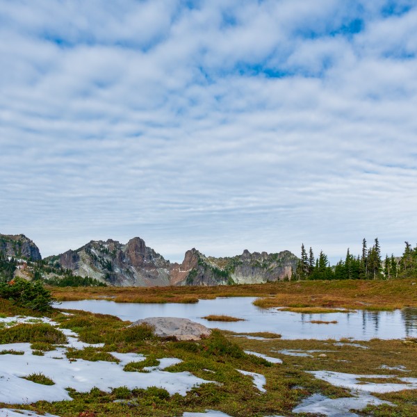 Snow melting in mountain valley