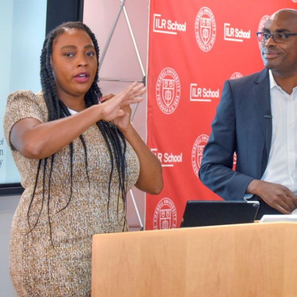 Tashara M. Leak, assistant professor in the Division of Nutritional Sciences and co-director of the Action Research Collaborative (ARC), left, and Neil Lewis Jr., ARC co-director and assistant professor of communication and social behavior, speak at a symposium