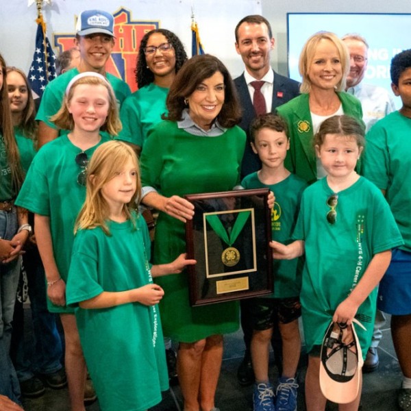 Dean Ben Houlton and Gov. Kathy Hochul stand with other 4-H members as Hochul receives her award