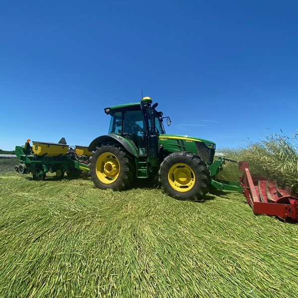 tractor with front mounted roller crimper