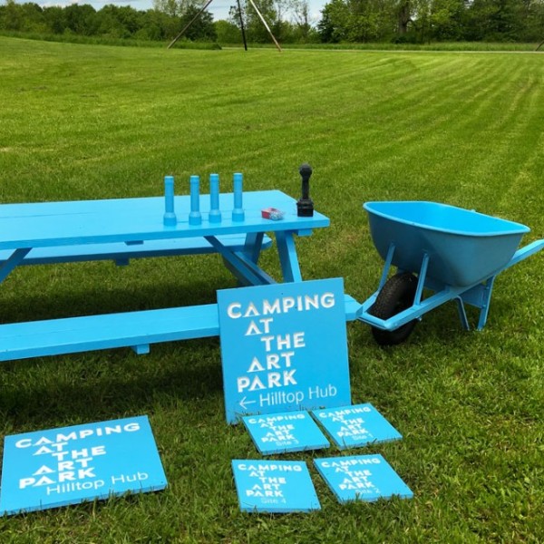 A picnic table, signage, a chair, a wheelbarrow, and even flashlights, all painted the same bright shade of blue