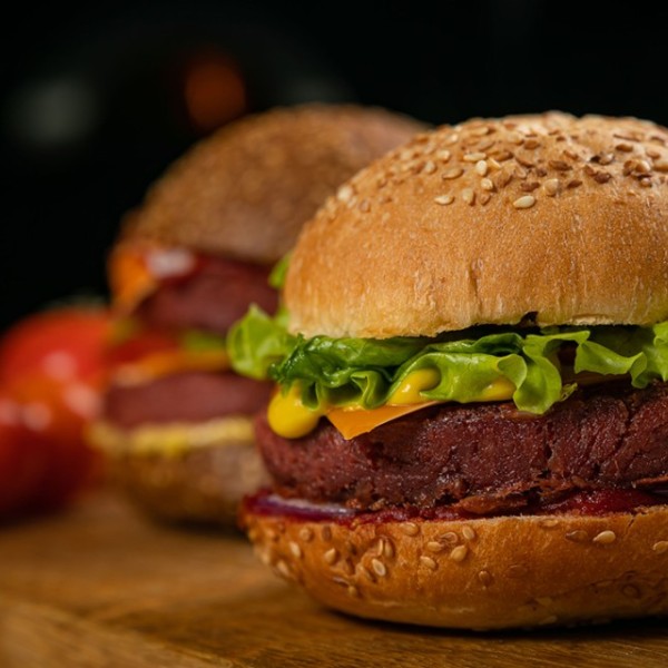 a plant based burger on a wooden table