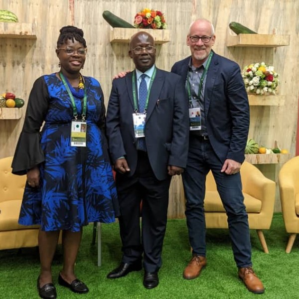 Three individuals at a television studio