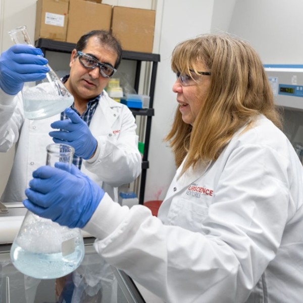 Forte Protein postdoctoral research Imran Kahn, left, and CEO Kathleen Hefferon conduct work in their new laboratory space at the Center for Life Science Ventures business incubator. 