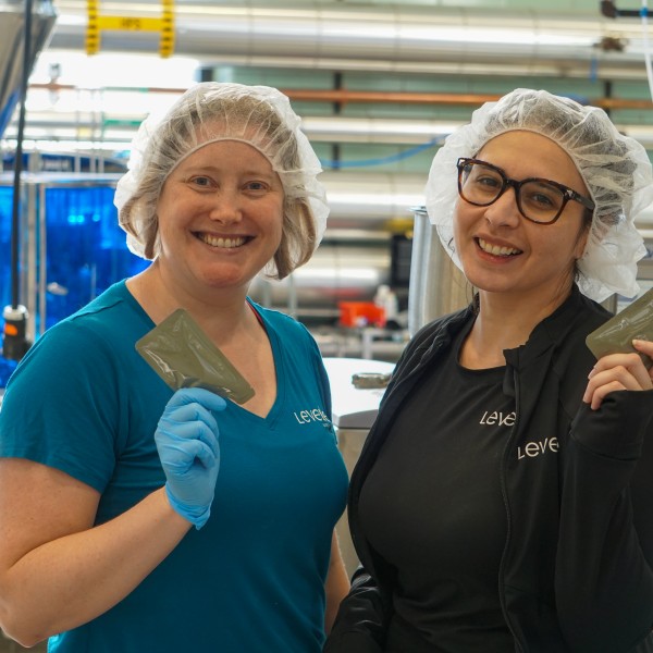 Stephanie Schrauth (left) and Linda Alvarez (right) holding pouches. 