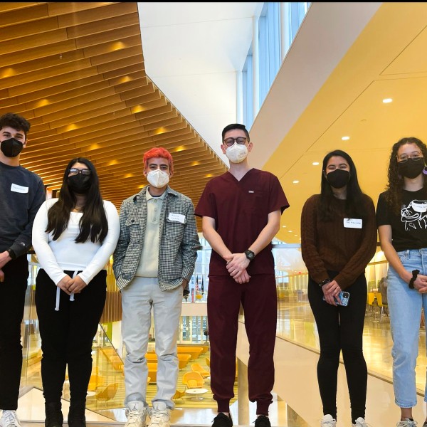 students smile for photo in vet school