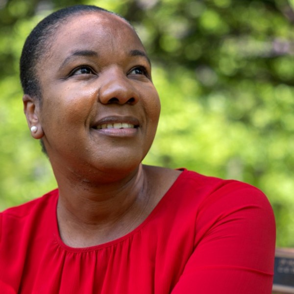 Monifa Morgan-Bell, program assistant for the Feed the Future Innovation Lab for Crop Improvement, is recognized for paying it forward while fostering and promoting Cornell’s ideals and values. Morgan-Bell is pictured in the garden area behind Warren Hall.