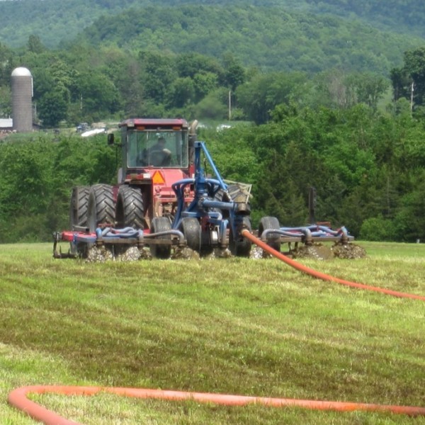 Manure spreader in field