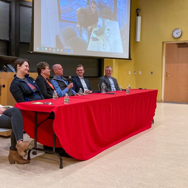 People sitting at panel table