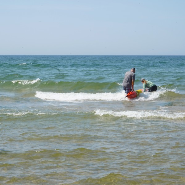three people launching LRAUV