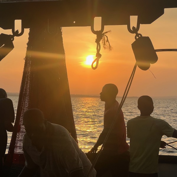 Silhouette of fisherman on a boat