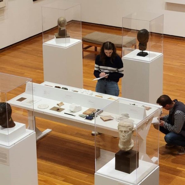 students taking notes at a display at the Johnson Museum