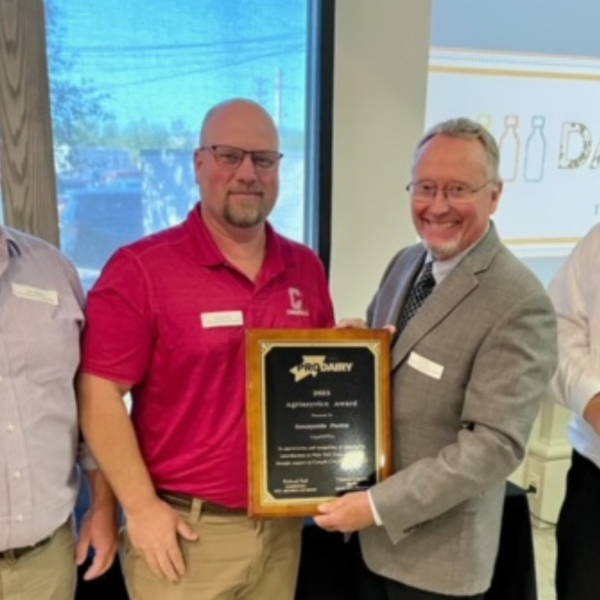 four people in an awards ceremony