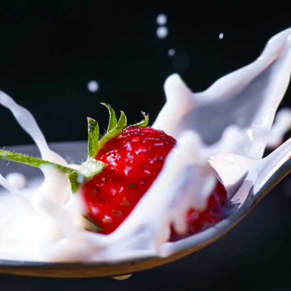 Milk splashing in a spoon.