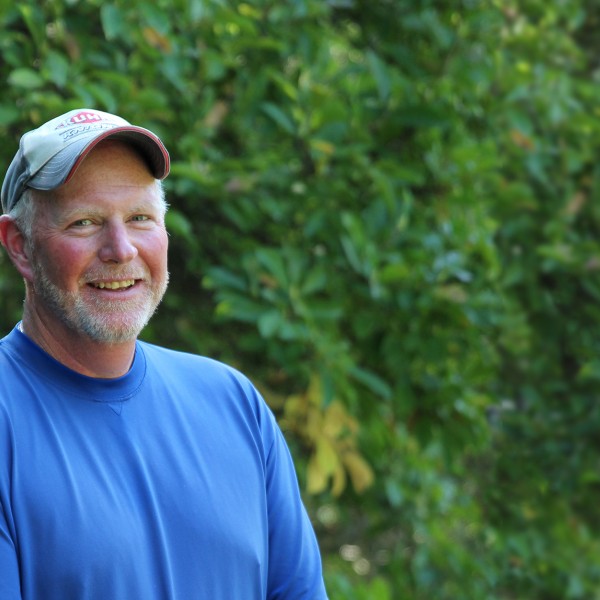 Rick Randolph in front of trees