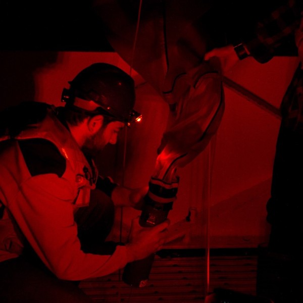 Person removing cod end of limnology net