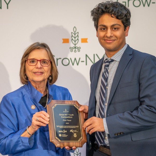 Assemblywoman Donna Lupardo hands the first place award in the Grow-NY Youth Competition to Arjun Bindra
