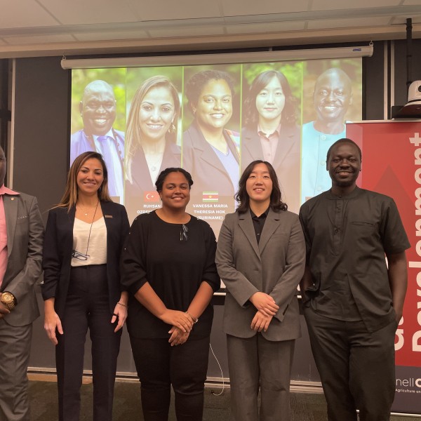 Five panelists pose for photo