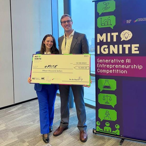 Julia Sebastien holding large check