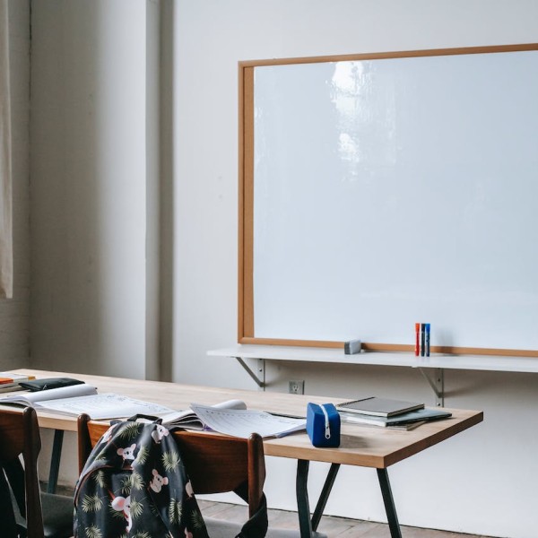 School desks in front of white board