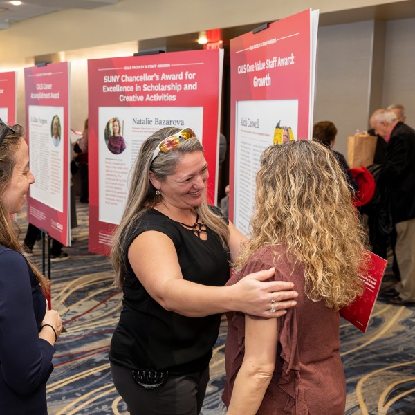 Event attendees socialize in an event hall.