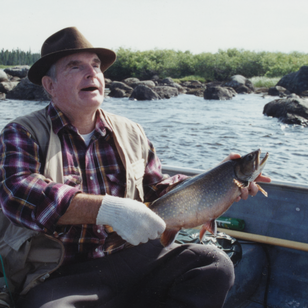 Daniel G. Sisler holding a fish.