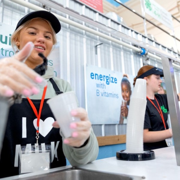 Students serve up milk on the first day of the New York State Fair.