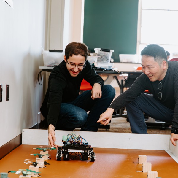 CALS professor Sunghwan (Sunny) Jung collaborates with a student on the design of the strawberry pruning robot
