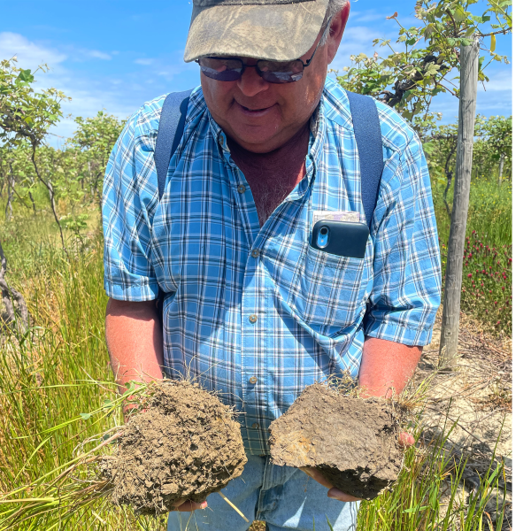 man holding soil in his hands