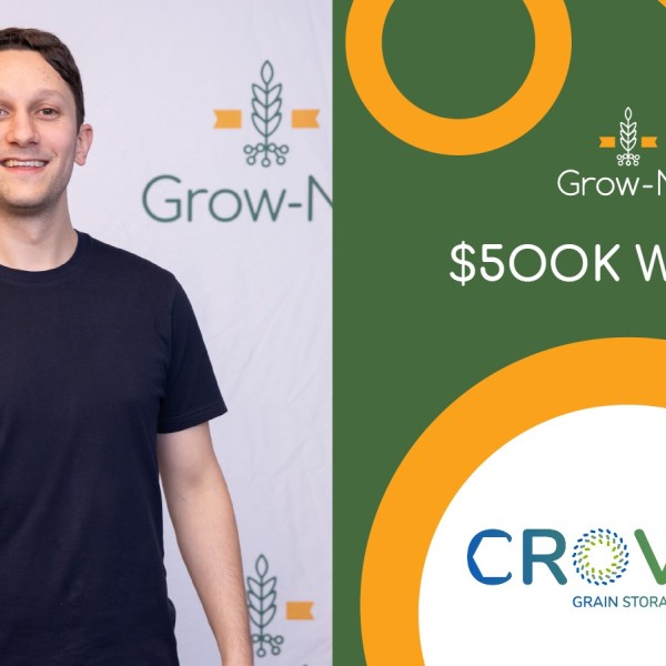 A man holding a trophy