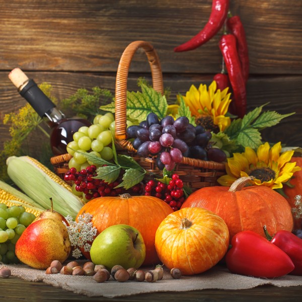basket filled with produce and wine