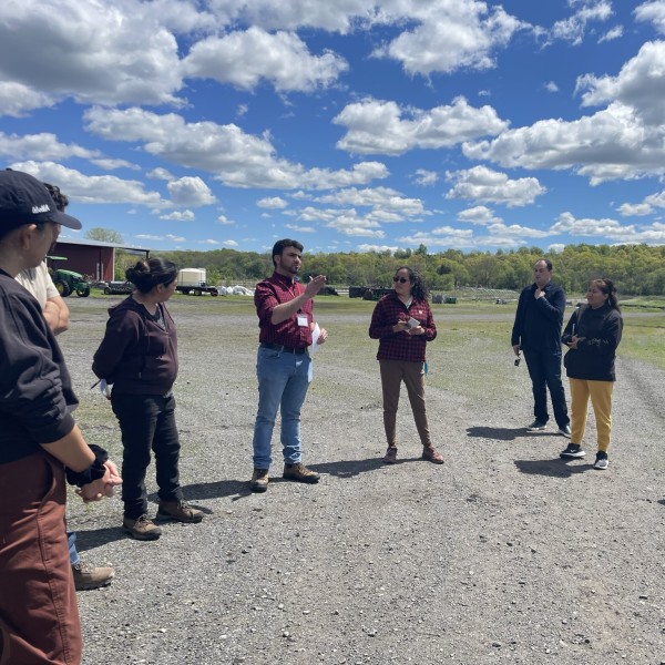 Raul Lemus Garza speaking to a group of people outdoors