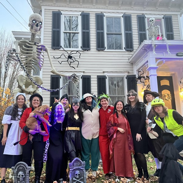 faculty pose at halloween party