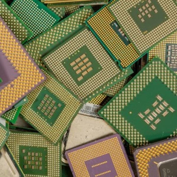 Pile of yellow and green computer chips of various sizes